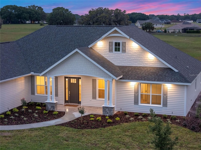 1784 NW 85th Loop, Ocala, FL 34475 - view of front of property featuring a shingled roof, a front yard, and a porch