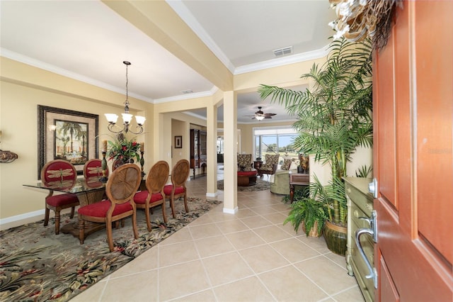 dining area featuring baseboards, visible vents, ceiling fan with notable chandelier, crown molding, and light tile patterned floors