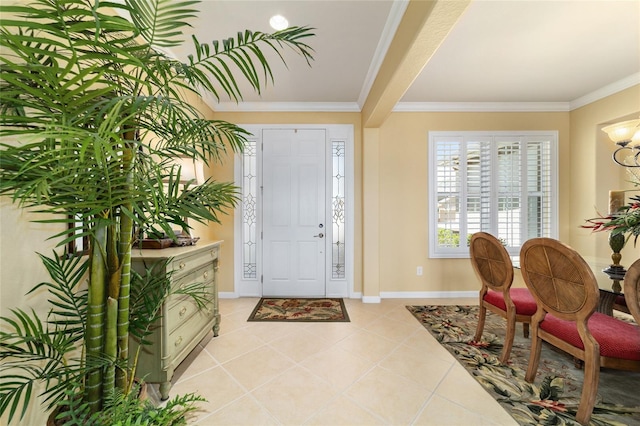 entryway with crown molding, baseboards, and light tile patterned floors