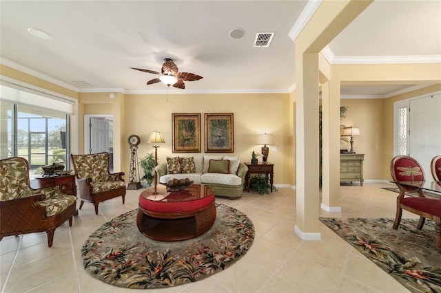 living area with light tile patterned flooring, visible vents, ornamental molding, and ceiling fan