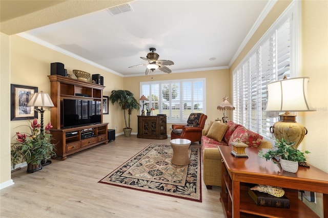 living area featuring ceiling fan, baseboards, visible vents, and light wood-style flooring