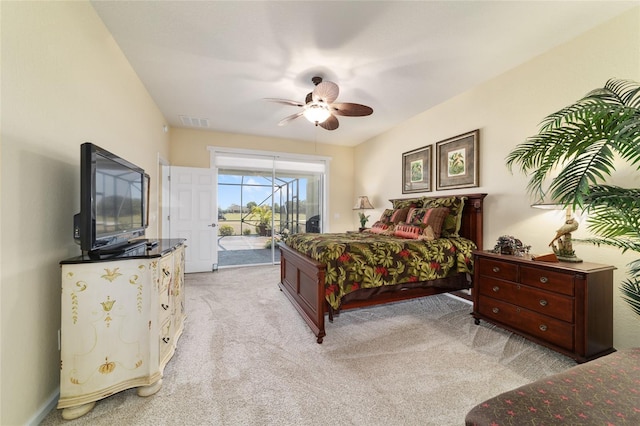 bedroom featuring a ceiling fan, light carpet, access to outside, and visible vents