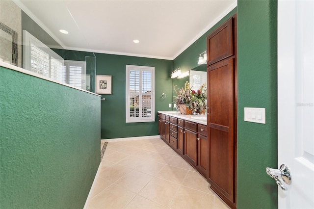 full bathroom with recessed lighting, double vanity, tile patterned floors, and ornamental molding