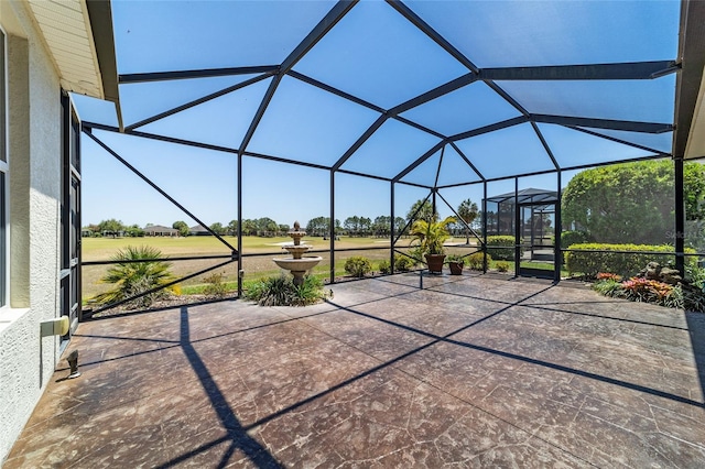 view of patio / terrace featuring glass enclosure