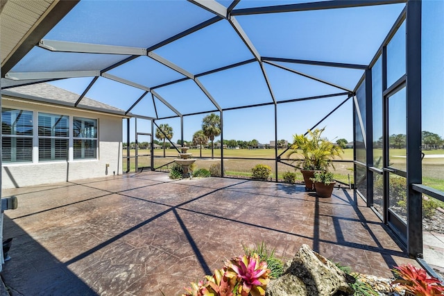 view of patio / terrace featuring a lanai