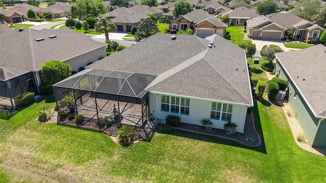 birds eye view of property with a residential view