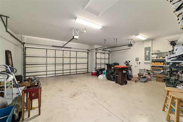 garage featuring a garage door opener and electric panel