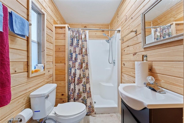 bathroom featuring wooden walls, toilet, vanity, and a shower with curtain