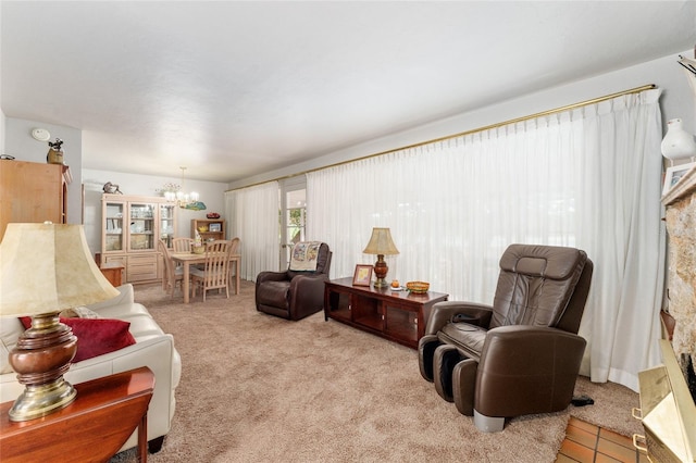 carpeted living area with a notable chandelier