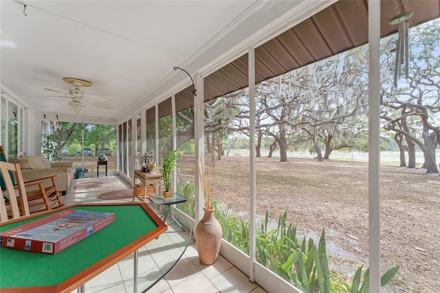 sunroom featuring a wealth of natural light and ceiling fan
