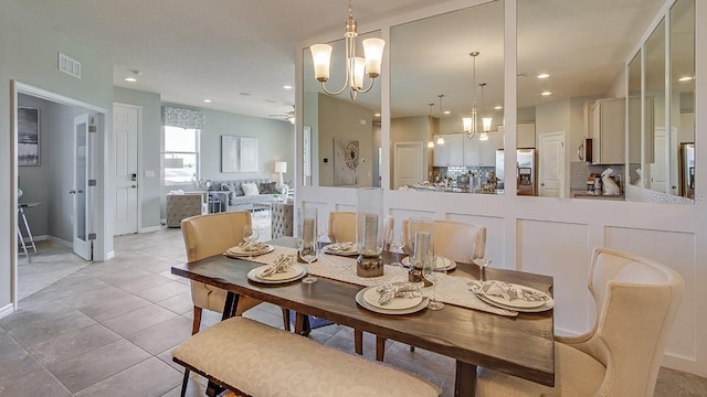 dining area with visible vents, baseboards, recessed lighting, ceiling fan with notable chandelier, and light tile patterned flooring