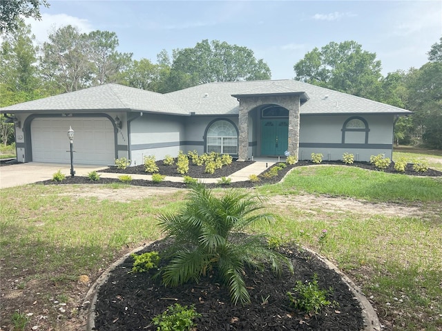 20364 SW 86th Loop, Dunnellon, FL 34431 - ranch-style house featuring stucco siding, an attached garage, driveway, and a front lawn