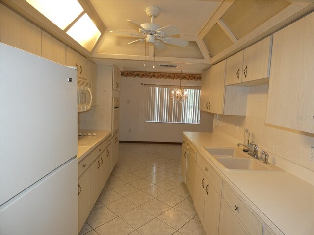 20364 SW 86th Loop, Dunnellon, FL 34431 - kitchen with white appliances, a sink, a tray ceiling, light countertops, and ceiling fan