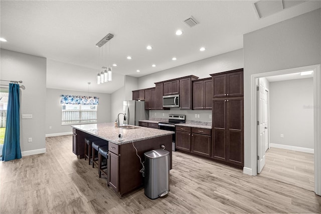 kitchen with visible vents, recessed lighting, light wood-style floors, and appliances with stainless steel finishes