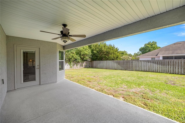 view of patio with a fenced backyard and ceiling fan