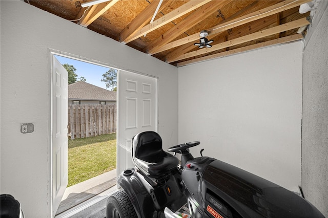 exercise room featuring vaulted ceiling