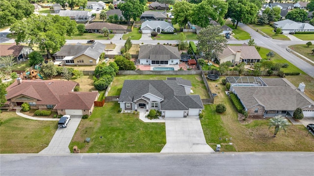 birds eye view of property with a residential view