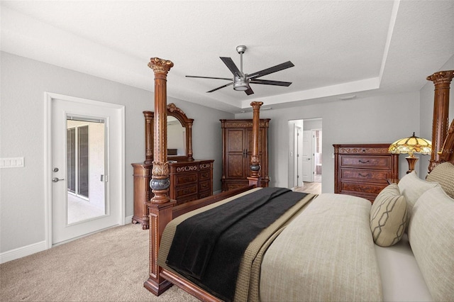 bedroom featuring a ceiling fan, baseboards, decorative columns, light colored carpet, and access to outside