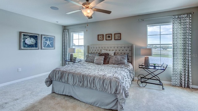 bedroom with baseboards, a ceiling fan, and carpet floors
