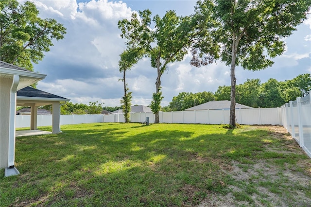 view of yard with a fenced backyard
