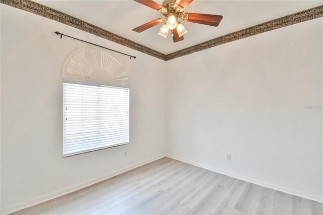 2339 NW 55th Avenue Rd, Ocala, FL 34482 - unfurnished room with light wood finished floors, ceiling fan, and baseboards