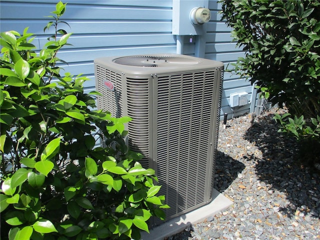 details featuring electric meter and central air condition unit