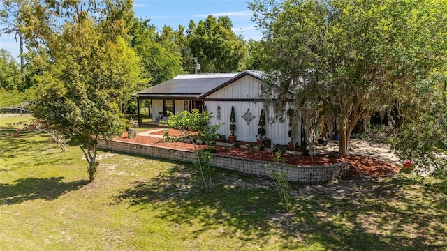 18695 Ne 5th Terrace Road, Citra, FL 32113 - back of house featuring a yard and board and batten siding