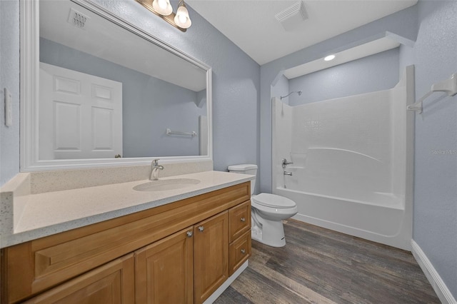 2312 SW 140th Ct, Ocala, FL 34481 - bathroom featuring vanity, toilet, wood finished floors, and  shower combination