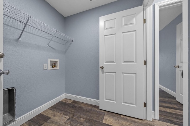 2312 SW 140th Ct, Ocala, FL 34481 - laundry room with hookup for a washing machine, dark wood-style flooring, and baseboards