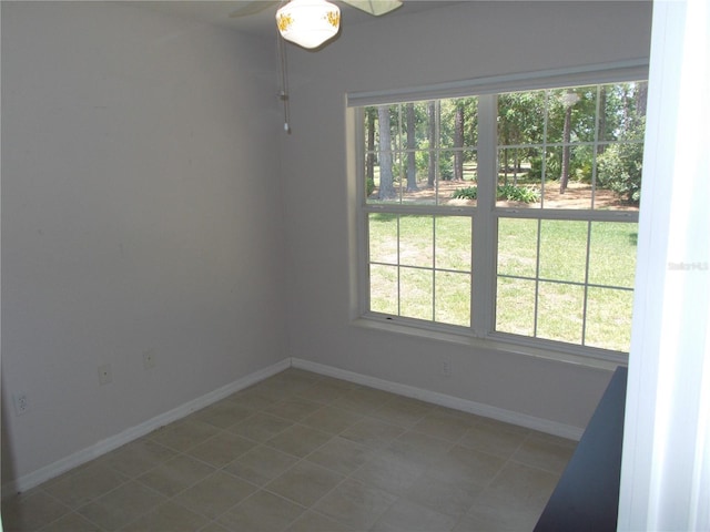 11653 SW 72nd Cir, Ocala, FL 34476 - empty room with plenty of natural light, baseboards, and tile patterned floors
