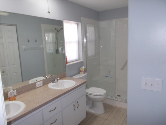 11653 SW 72nd Cir, Ocala, FL 34476 - bathroom featuring walk in shower, toilet, double vanity, and tile patterned flooring