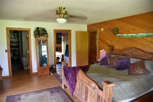 bedroom with wood finished floors and ceiling fan