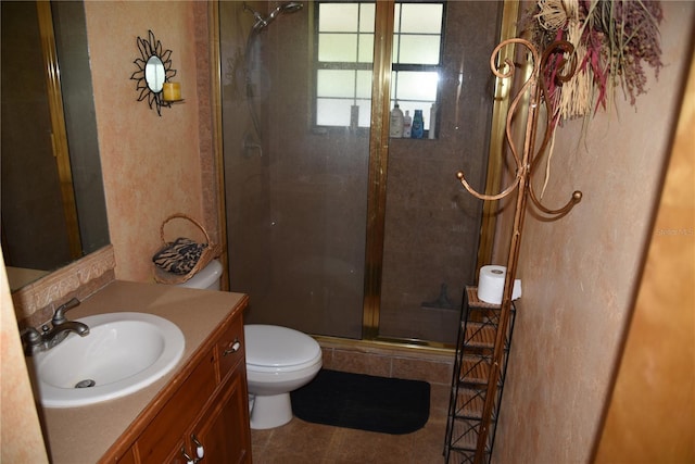 full bath with tile patterned flooring, a shower stall, toilet, and vanity