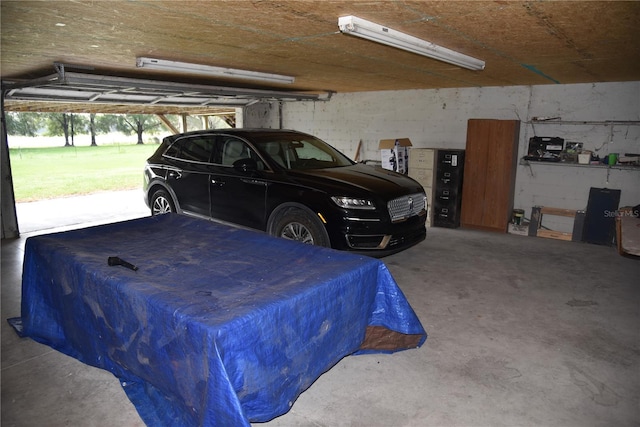 garage with concrete block wall