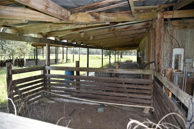 wooden deck featuring an exterior structure and an outbuilding