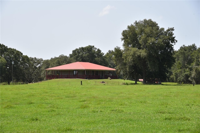 view of home's community with a yard