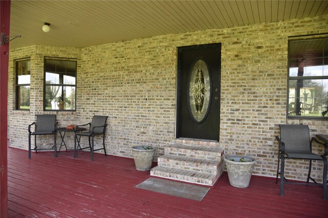 exterior space with entry steps and a deck