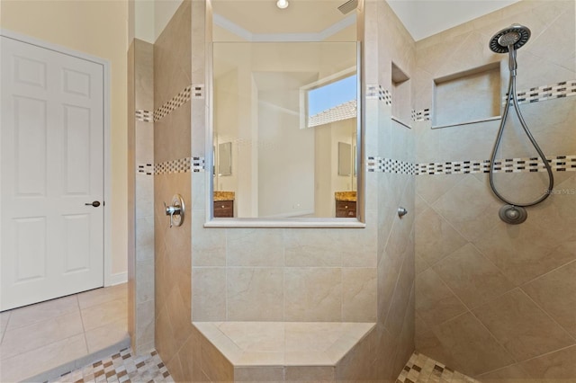 bathroom with crown molding, tile patterned flooring, and a walk in shower