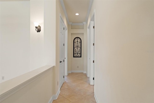 hallway featuring baseboards, recessed lighting, and light tile patterned floors