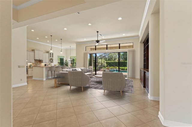 living room with light tile patterned floors, a ceiling fan, crown molding, and recessed lighting