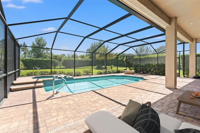 view of pool with glass enclosure, a pool with connected hot tub, and a patio area