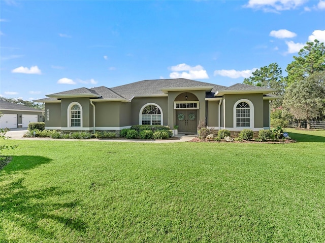 4658 W Hacienda Dr, Beverly Hills, FL 34465 - view of front of home with stone siding, a front lawn, and stucco siding