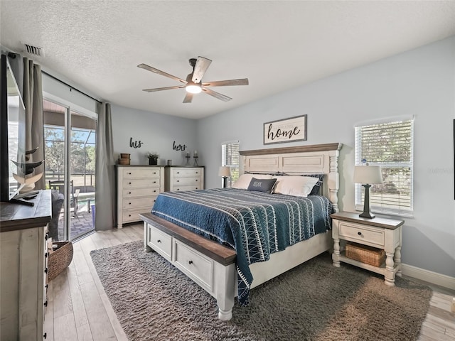 4658 W Hacienda Dr, Beverly Hills, FL 34465 - bedroom featuring light wood-type flooring, ceiling fan, baseboards, access to outside, and visible vents