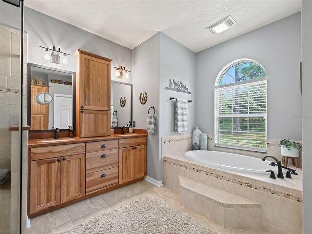 4658 W Hacienda Dr, Beverly Hills, FL 34465 - full bathroom featuring a bath, visible vents, a sink, and double vanity