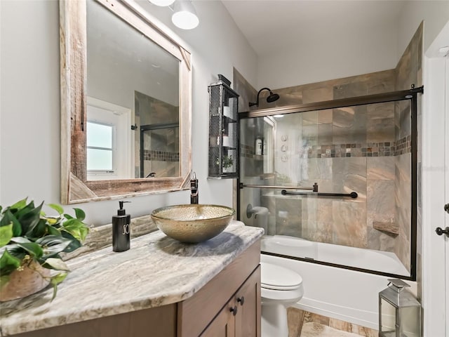 4658 W Hacienda Dr, Beverly Hills, FL 34465 - bathroom with vanity, bath / shower combo with glass door, and toilet