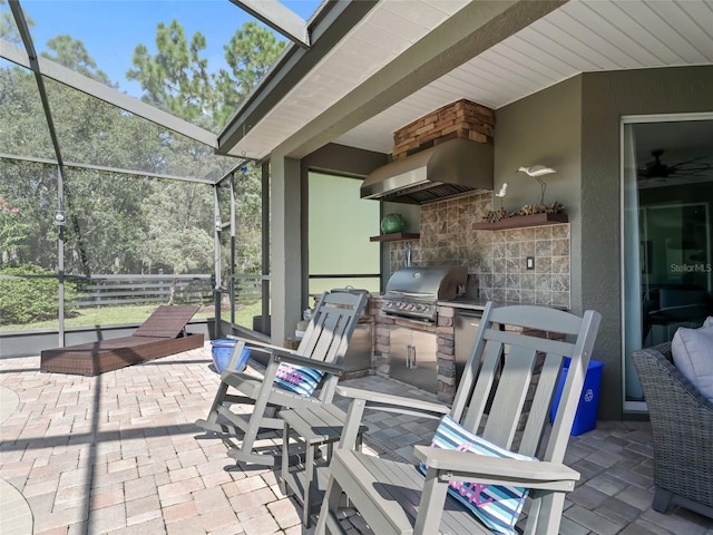 4658 W Hacienda Dr, Beverly Hills, FL 34465 - view of patio / terrace featuring glass enclosure and area for grilling