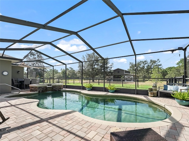 4658 W Hacienda Dr, Beverly Hills, FL 34465 - view of pool featuring glass enclosure, a patio area, and a pool with connected hot tub
