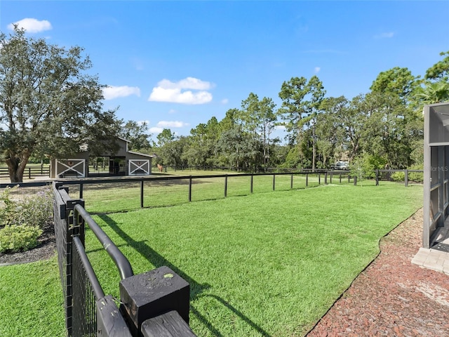 4658 W Hacienda Dr, Beverly Hills, FL 34465 - view of yard with an outdoor structure, a barn, and fence