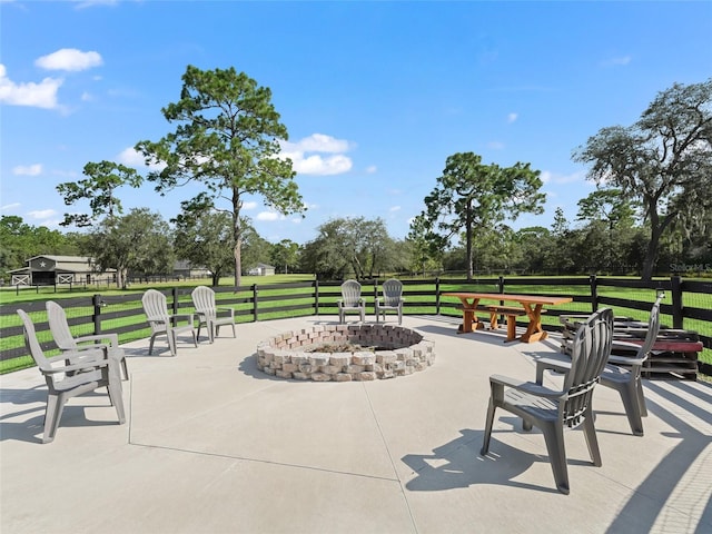4658 W Hacienda Dr, Beverly Hills, FL 34465 - surrounding community featuring fence, a patio area, a lawn, and a fire pit