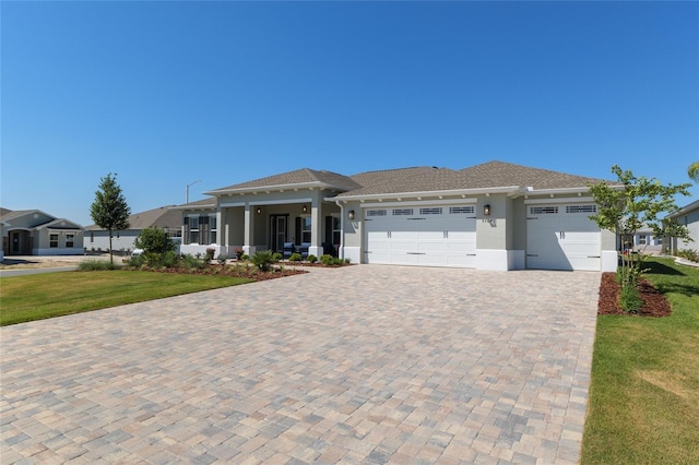 9764 SW 81st Ln, Ocala, FL 34481 - view of front of house featuring stucco siding, driveway, a front yard, and a garage